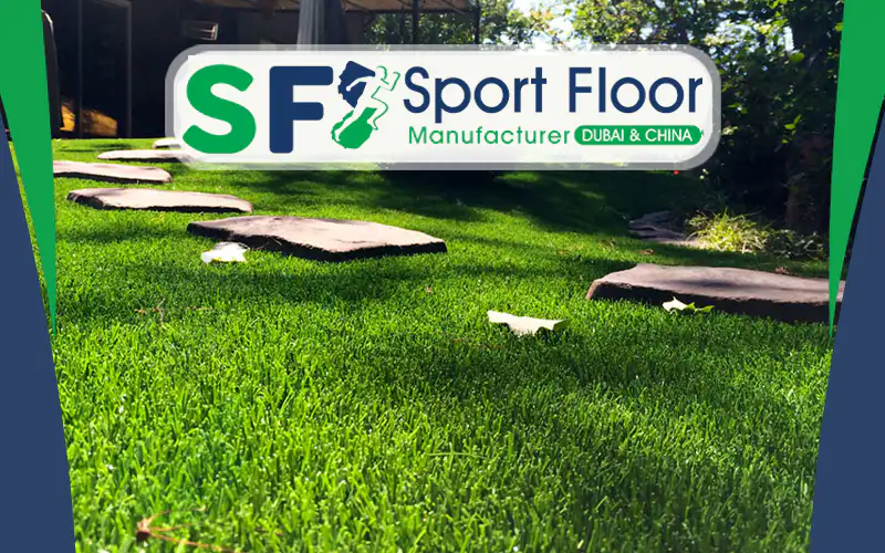 Artificial grass installed in a landscaped garden with stone pathways