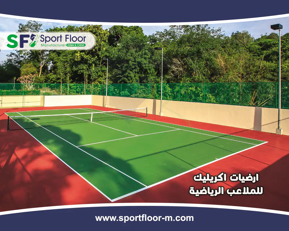 Green acrylic tennis court with red surrounding area and perimeter drainage