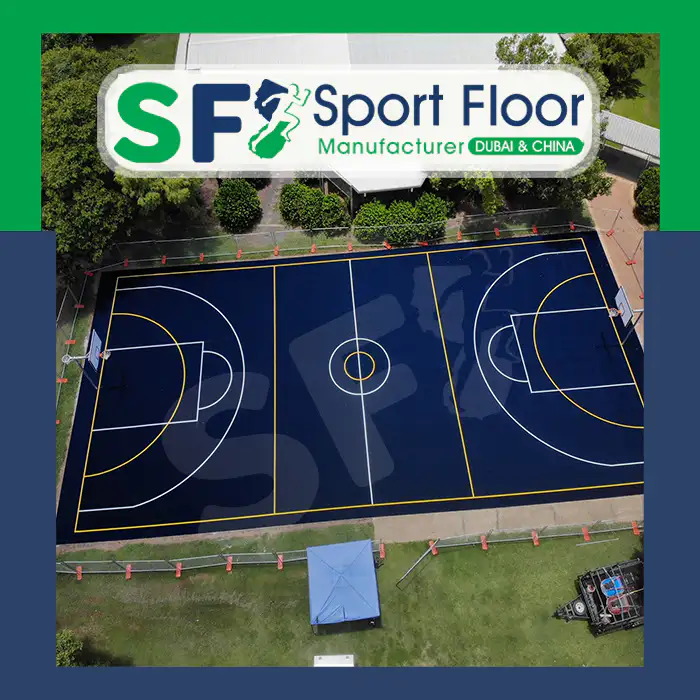 Aerial view of a dark blue acrylic basketball court with contrasting line markings