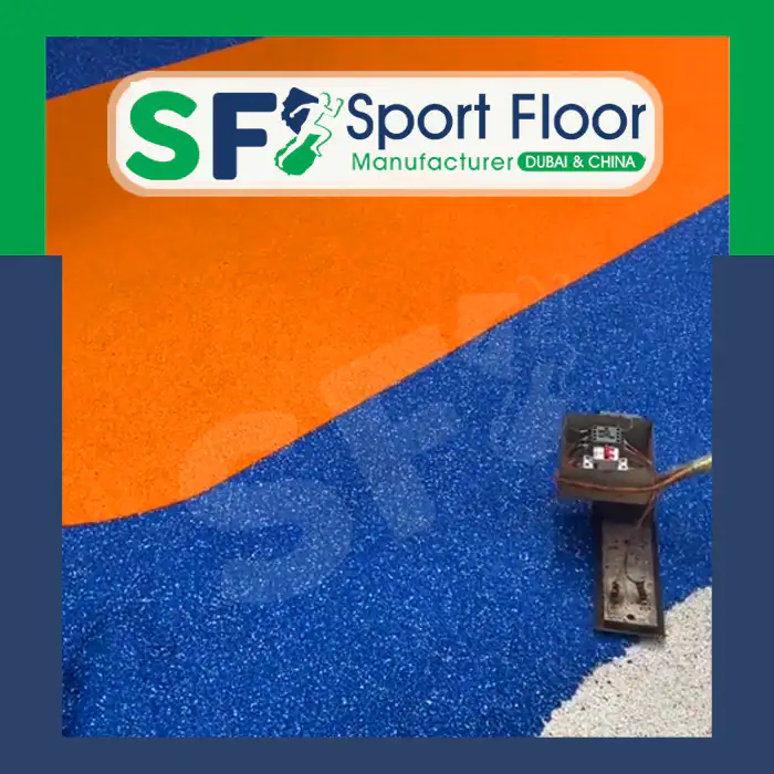 Moisture or water visible on a blue and orange sports surface