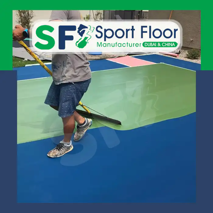 Application of a green acrylic court coating using a squeegee
