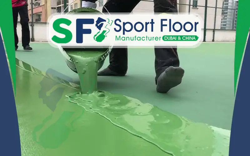 Green acrylic court material being poured onto a prepared surface