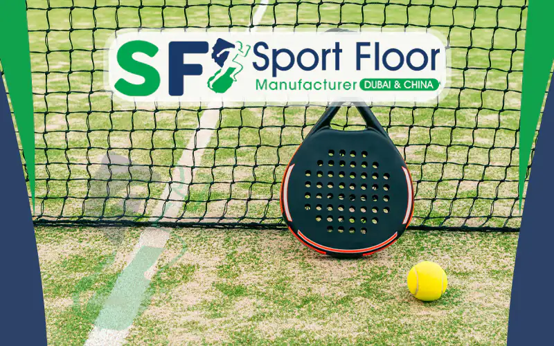 Padel racket and ball on artificial grass requiring brushing and sand maintenance