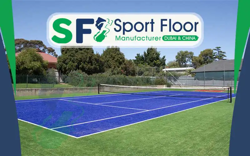 Blue artificial turf court with green surrounding area