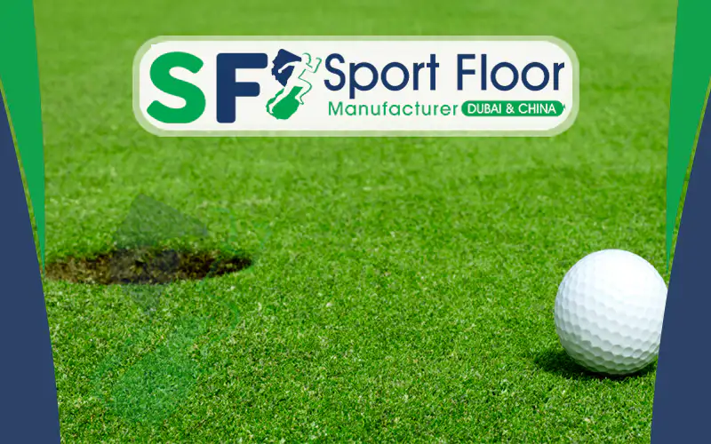 Golf ball beside a practice hole on short artificial putting turf