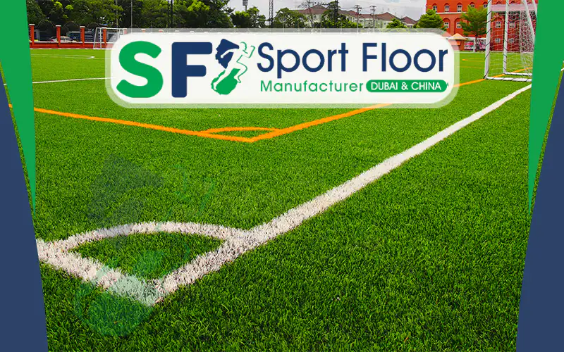 Artificial football field with white and orange line markings