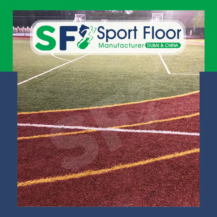 Community multi-sport artificial grass field with surrounding colored surface