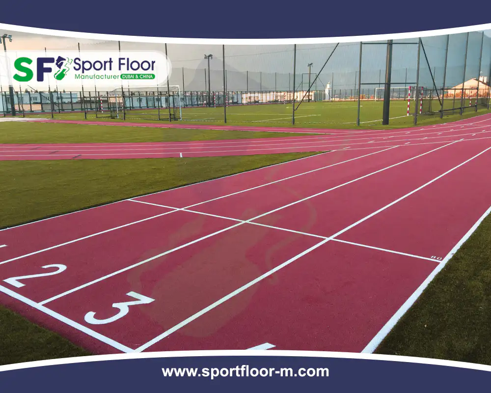 Red athletics track with numbered lanes and start markings