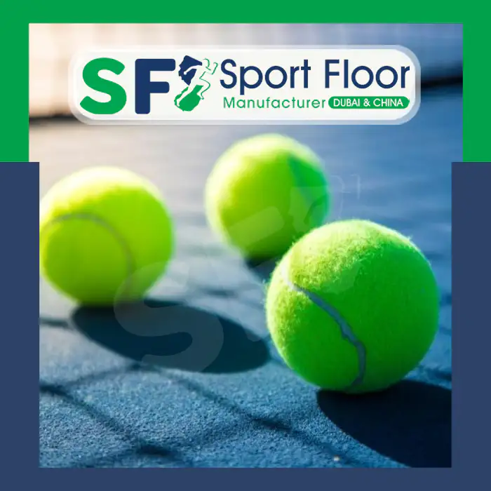 Tennis balls resting on a blue court surface
