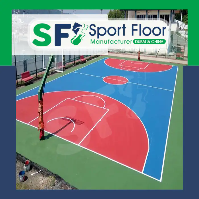 Blue and red outdoor acrylic basketball court with green surround