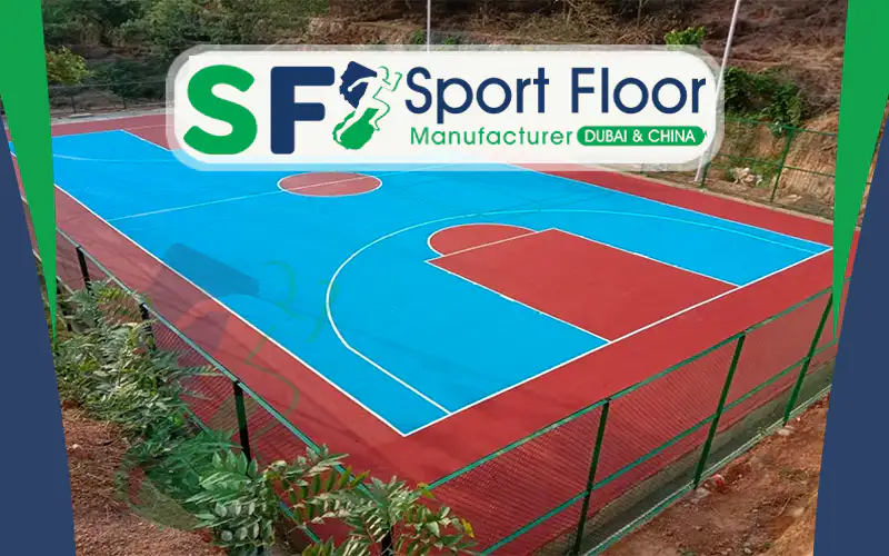 Blue and red outdoor basketball court enclosed by fencing