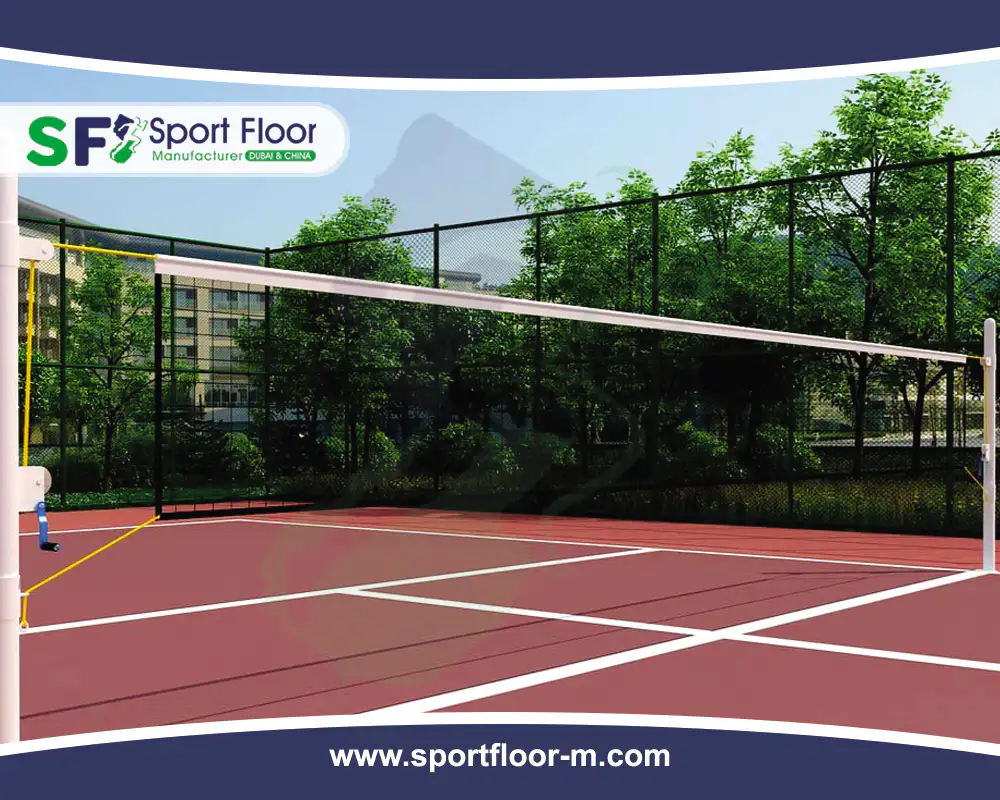 Red outdoor acrylic volleyball court with fencing and net-post system