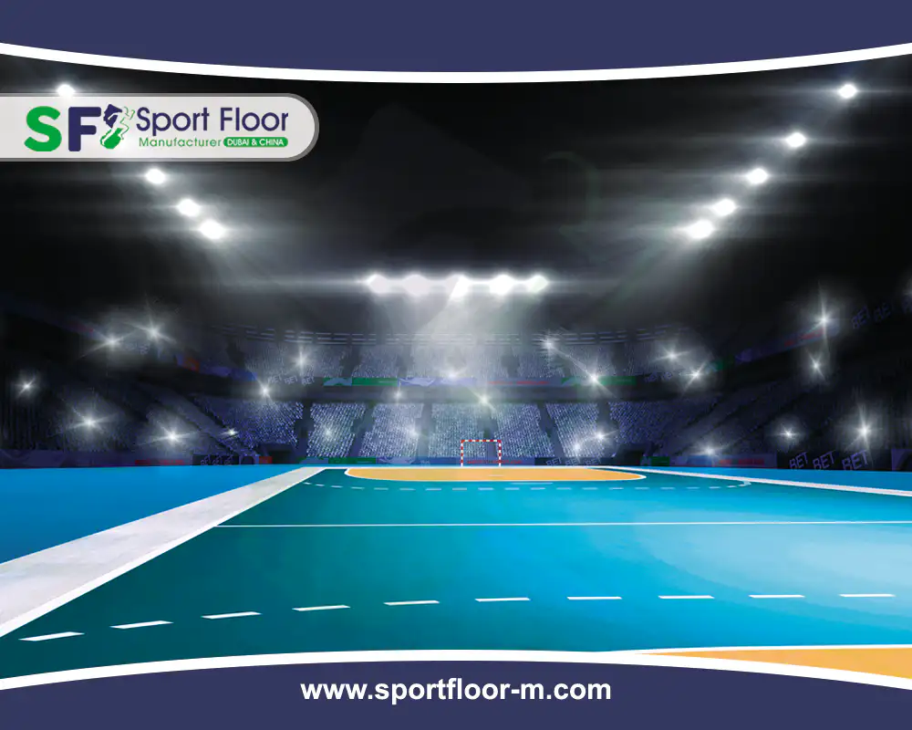Blue indoor handball court showing goal-area and free-throw markings