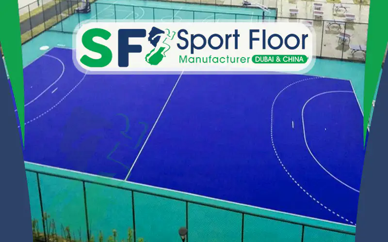 Outdoor handball court with synthetic surface and perimeter fencing
