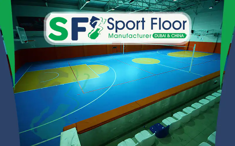 Indoor blue multi-sport court with goals, posts and spectator seating