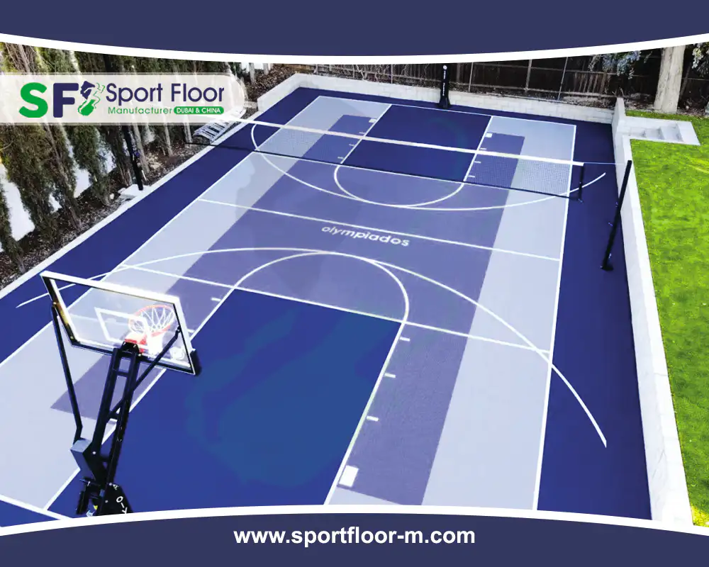 Blue and grey multi-sport court with basketball backstop and net posts