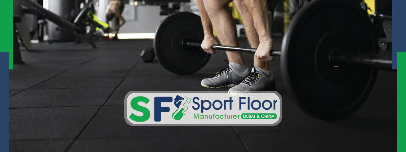 Wide gym view with black rubber tiles under a deadlift zone