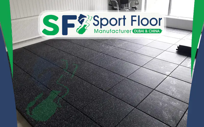 Black rubber tiles installed in an indoor training room