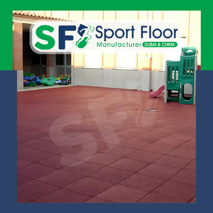 Red rubber tiles installed in an indoor play area