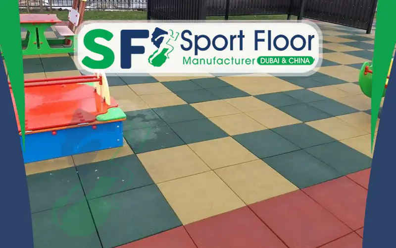 Green yellow and red rubber tiles in a playground checkerboard pattern
