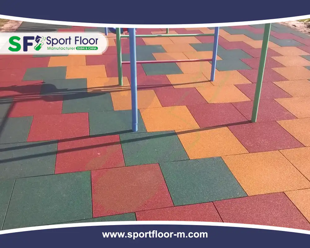 Multicolor rubber tiles installed below playground structures
