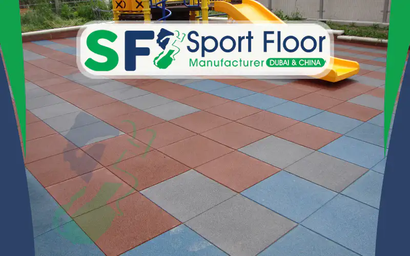 Red blue and grey colored rubber tiles around playground equipment