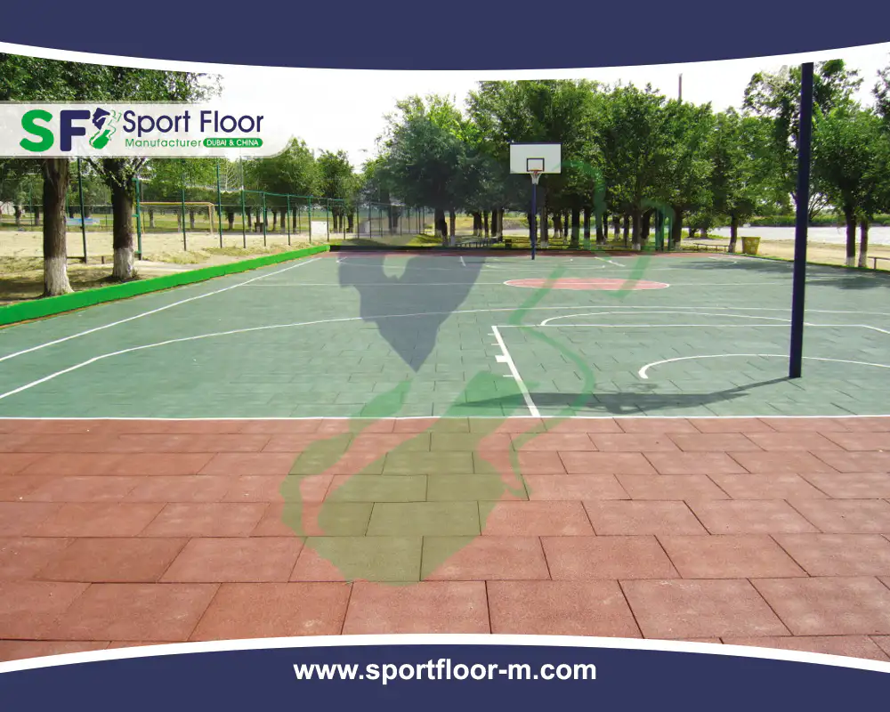 Rubber tiles installed around an outdoor basketball court