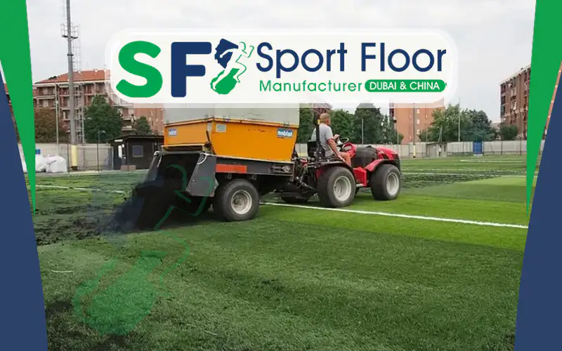 SBR rubber granules being distributed on a synthetic turf field