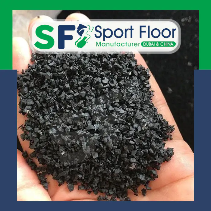 Close-up of black SBR rubber granules in a hand