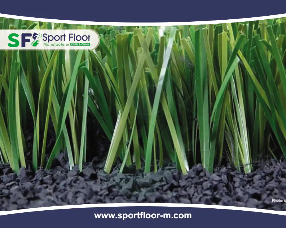 Black SBR rubber granules shown at the base of artificial grass fibers