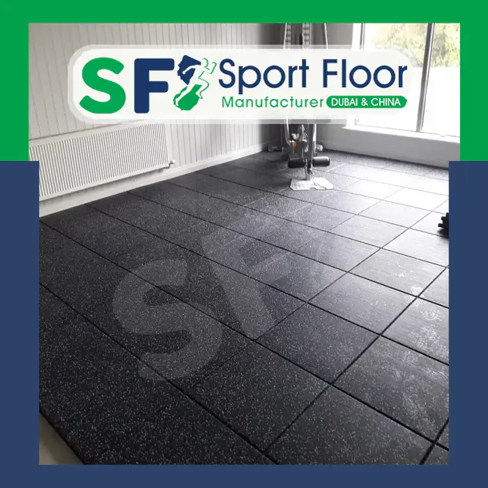 Speckled black rubber tiles installed in an indoor room